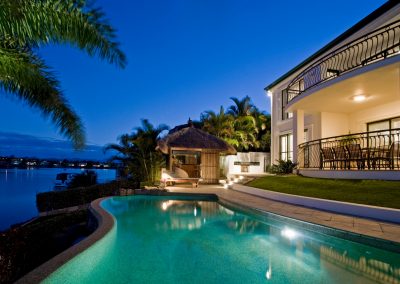 luxury backyard with pool in evening